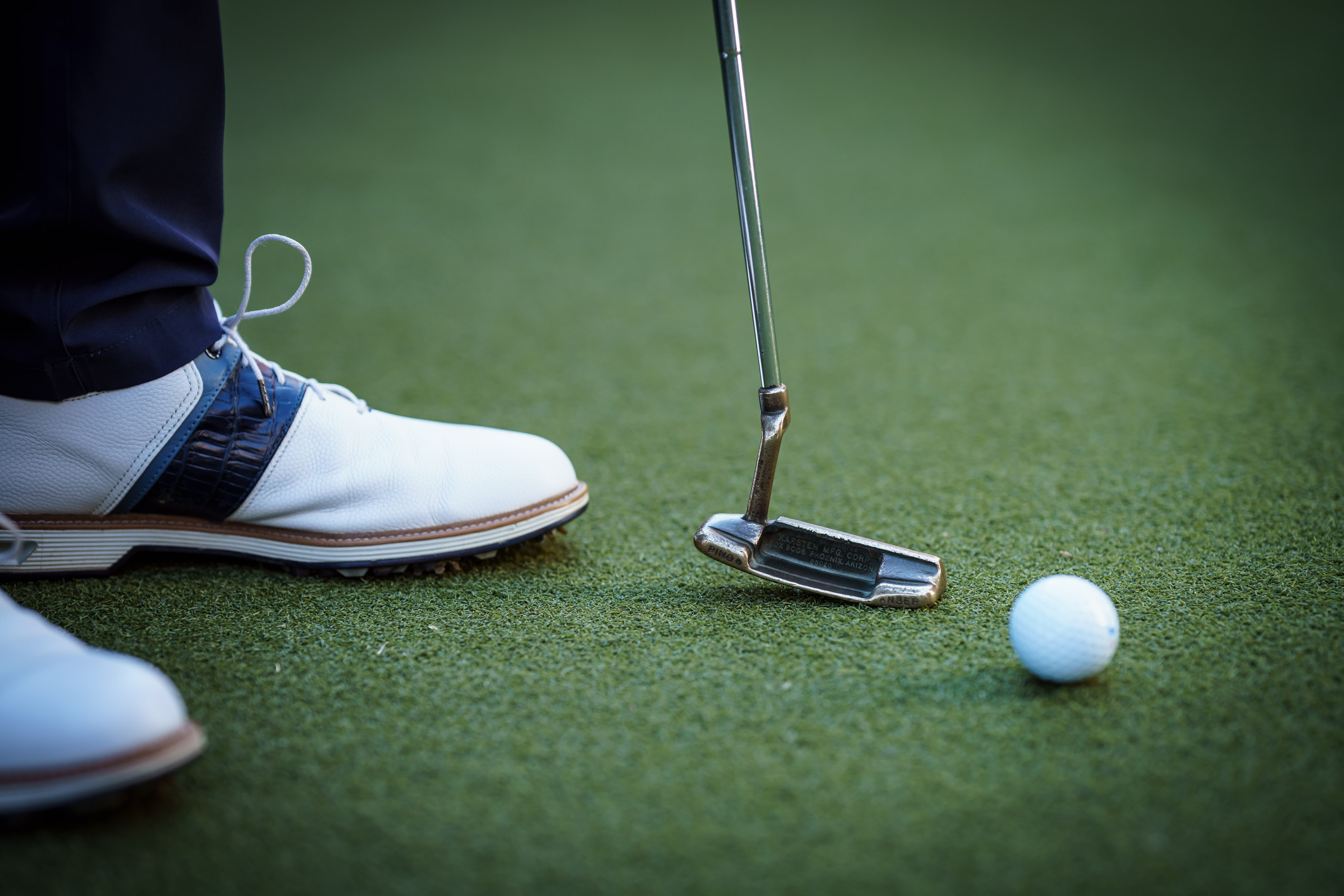 Putter at address on the green